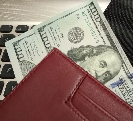Copywriter's wallet full of dollars